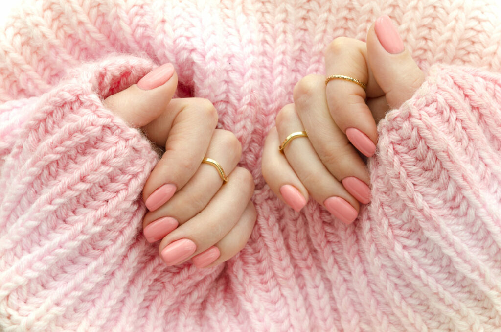 Pink gel nails woolly jumper