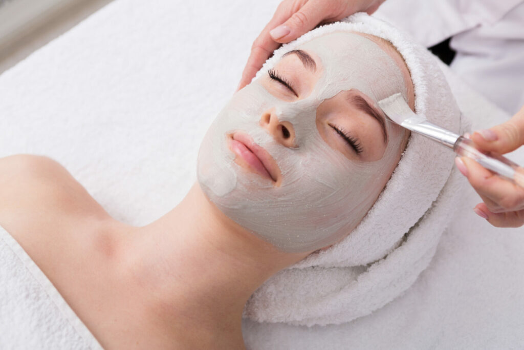 Woman having facial treatment